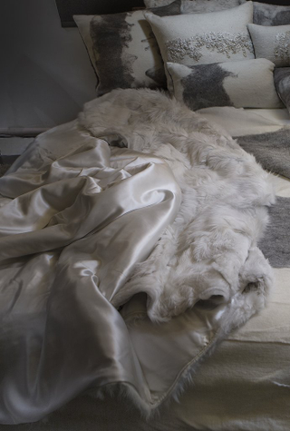 Illustration for article titled Luxury Real Fur Blankets, Throws & Pillows made with Authentic Toscana Sheep Fur